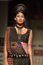 Model walks the ramp for Niki Mahajan show on Wills Lifestyle India Fashion Week 2011-Day 4 in Delhi on 9th April 2011 (130).JPG